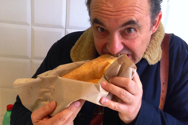 Manfredi chowing down on local fare along the Amalfi Coast. Image: Stefano Manfredi