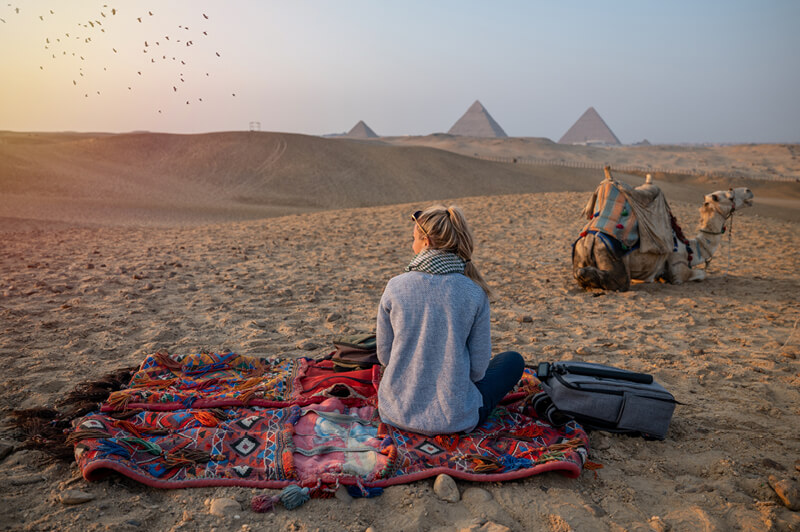 Ride camels from the fringe village of Khemliya into the desert, enjoy an unforgettable sunset over the dunes, and dine under the stars.