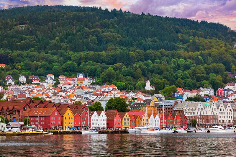 Embark in Bergen, home to the historic Bryggen Wharf