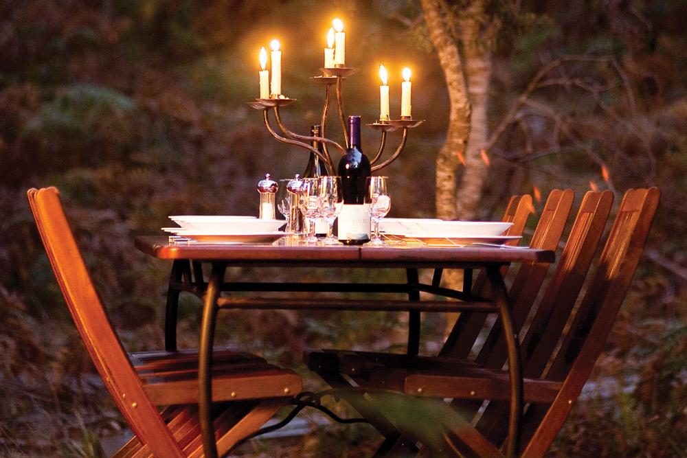 Candlelit dining at Casuarina Beach Camp. Image courtesy of The Maria Island Walk.