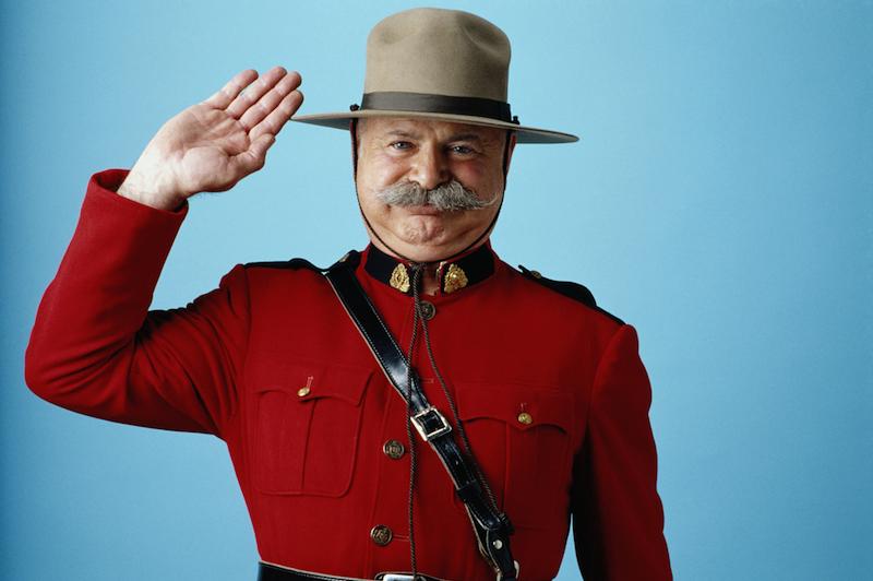 Royal Canadian Mounted Police officer in red ceremonial jacket
