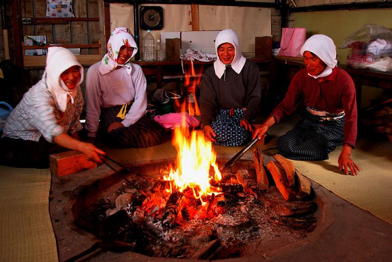 Japanese pearl divers around fire