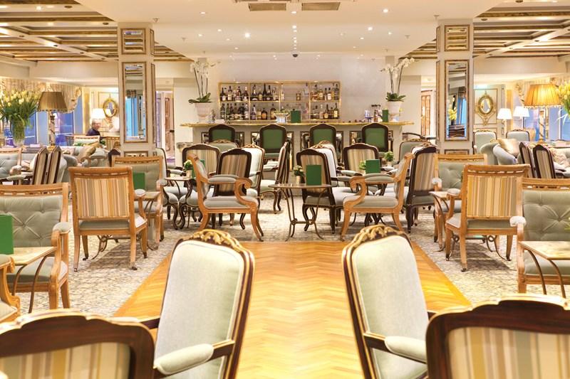 This image: Cocktail hour is held in the luxurious Salon du Grand Trianon each evening on board the SS Antoinette